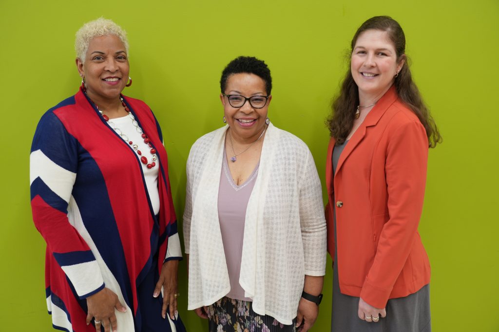 UNC Greensboro School of Nursing faculty members Dr. Wanda Williams, Dean Debra J. Barksdale, and Amber Vermeesch, who are all nurse practitioners, pose for a photo.