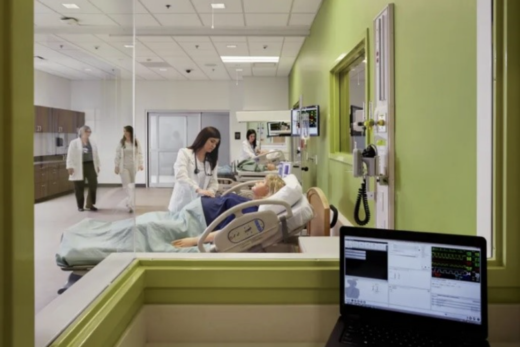 Observing nursing students engaging in simulation from the simulation control room.